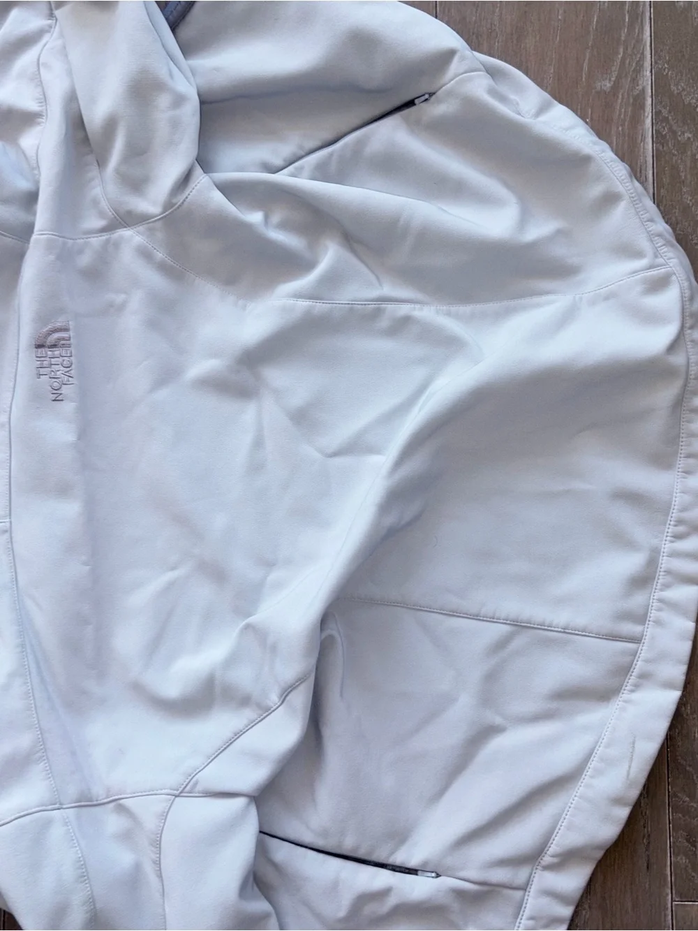The North Face Women's White Softshell Jacket with Light Gray Fleece Lining